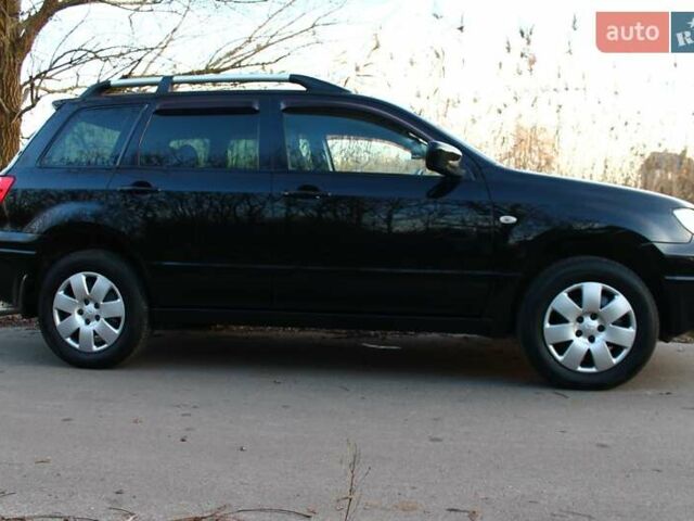 Черный Мицубиси Аутлендер, объемом двигателя 2 л и пробегом 190 тыс. км за 6900 $, фото 28 на Automoto.ua