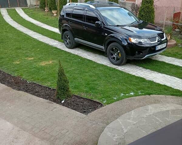 Черный Мицубиси Аутлендер, объемом двигателя 2.35 л и пробегом 245 тыс. км за 8000 $, фото 16 на Automoto.ua