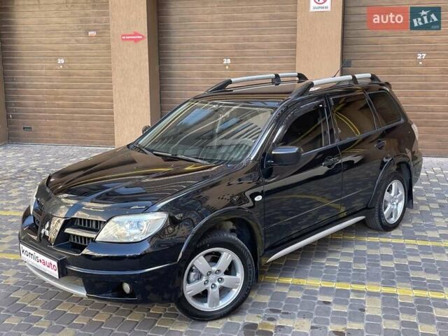 Черный Мицубиси Аутлендер, объемом двигателя 2 л и пробегом 270 тыс. км за 7199 $, фото 4 на Automoto.ua