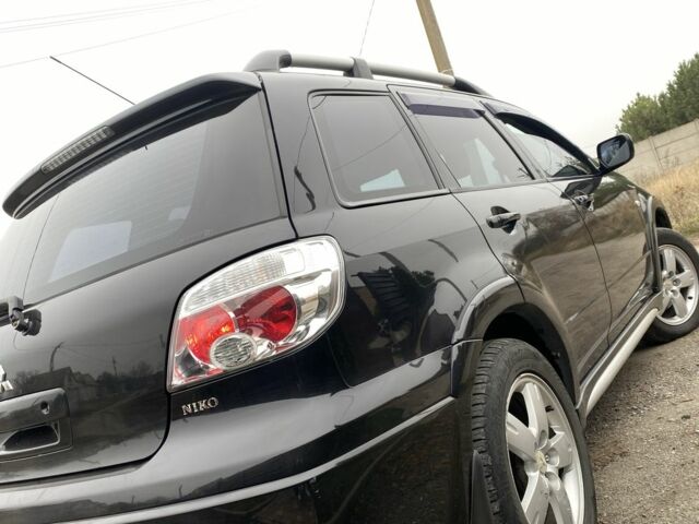 Черный Мицубиси Аутлендер, объемом двигателя 2.4 л и пробегом 178 тыс. км за 6900 $, фото 17 на Automoto.ua