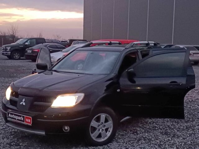 Черный Мицубиси Аутлендер, объемом двигателя 2 л и пробегом 271 тыс. км за 6940 $, фото 23 на Automoto.ua