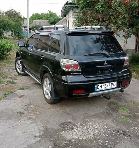 Черный Мицубиси Аутлендер, объемом двигателя 2 л и пробегом 240 тыс. км за 6500 $, фото 7 на Automoto.ua