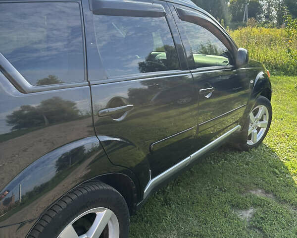 Черный Мицубиси Аутлендер, объемом двигателя 2.36 л и пробегом 240 тыс. км за 9599 $, фото 12 на Automoto.ua