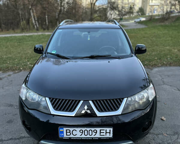Чорний Міцубісі Аутлендер, об'ємом двигуна 1.97 л та пробігом 300 тис. км за 8600 $, фото 1 на Automoto.ua