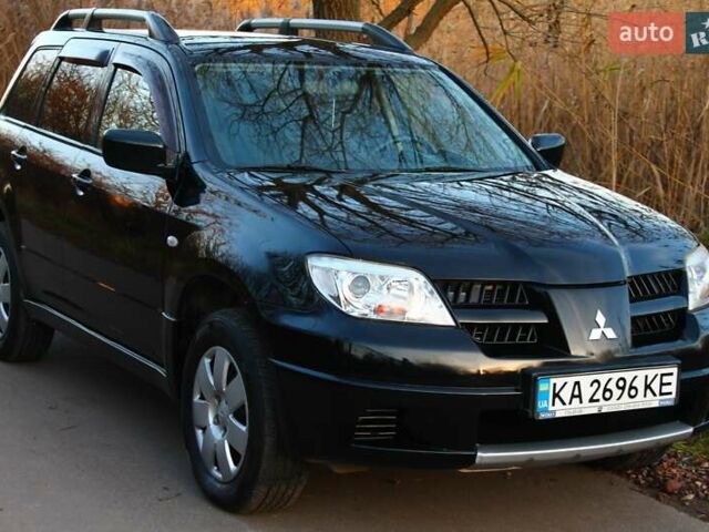 Черный Мицубиси Аутлендер, объемом двигателя 2 л и пробегом 190 тыс. км за 6900 $, фото 7 на Automoto.ua