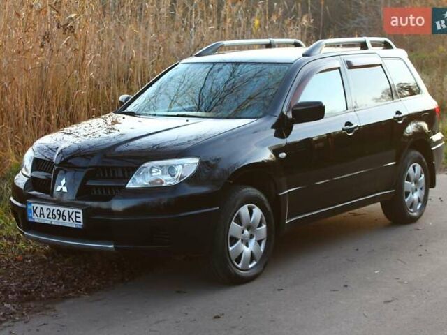 Черный Мицубиси Аутлендер, объемом двигателя 2 л и пробегом 190 тыс. км за 6900 $, фото 8 на Automoto.ua