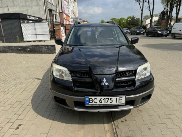 Чорний Міцубісі Аутлендер, об'ємом двигуна 2 л та пробігом 230 тис. км за 6650 $, фото 3 на Automoto.ua