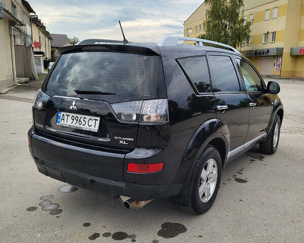 Чорний Міцубісі Аутлендер, об'ємом двигуна 2.4 л та пробігом 205 тис. км за 8400 $, фото 17 на Automoto.ua