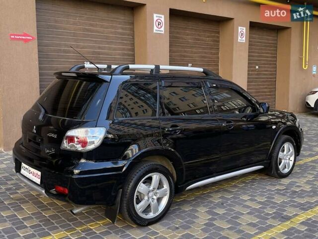 Черный Мицубиси Аутлендер, объемом двигателя 2 л и пробегом 270 тыс. км за 7199 $, фото 11 на Automoto.ua