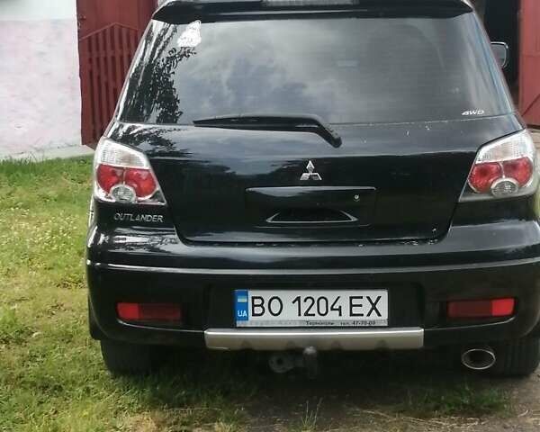 Чорний Міцубісі Аутлендер, об'ємом двигуна 2 л та пробігом 208 тис. км за 6700 $, фото 6 на Automoto.ua