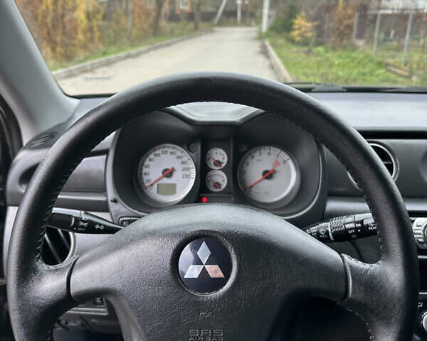 Чорний Міцубісі Аутлендер, об'ємом двигуна 2 л та пробігом 118 тис. км за 8100 $, фото 29 на Automoto.ua