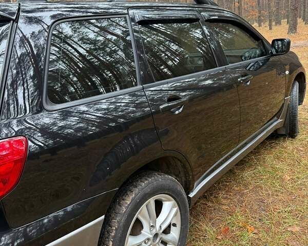 Черный Мицубиси Аутлендер, объемом двигателя 2 л и пробегом 232 тыс. км за 7000 $, фото 3 на Automoto.ua