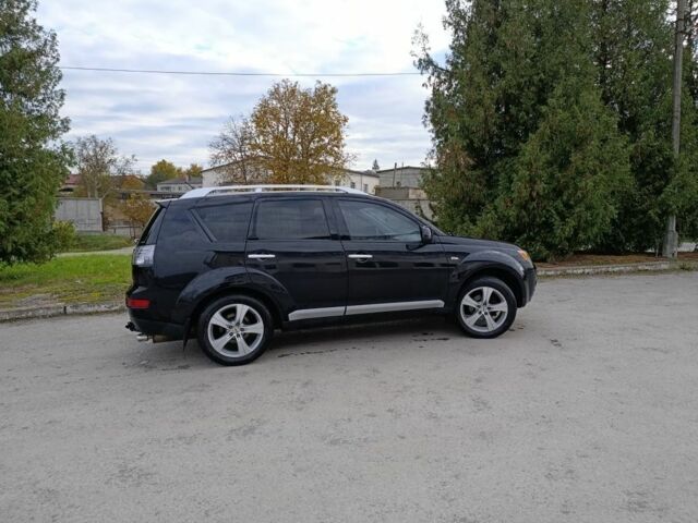Черный Мицубиси Аутлендер, объемом двигателя 2.2 л и пробегом 200 тыс. км за 9500 $, фото 4 на Automoto.ua