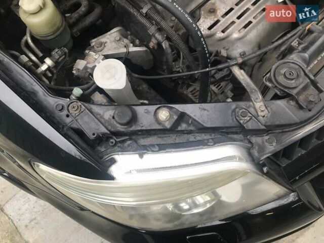 Чорний Міцубісі Аутлендер, об'ємом двигуна 2.38 л та пробігом 207 тис. км за 7000 $, фото 34 на Automoto.ua