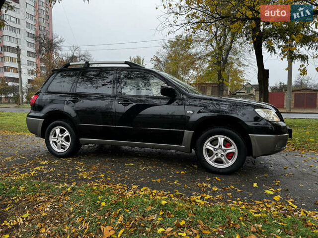 Чорний Міцубісі Аутлендер, об'ємом двигуна 2 л та пробігом 254 тис. км за 7499 $, фото 9 на Automoto.ua