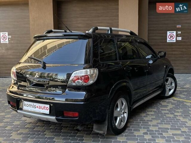 Черный Мицубиси Аутлендер, объемом двигателя 2 л и пробегом 270 тыс. км за 7199 $, фото 16 на Automoto.ua