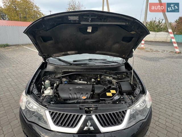Черный Мицубиси Аутлендер, объемом двигателя 2.4 л и пробегом 230 тыс. км за 6650 $, фото 64 на Automoto.ua
