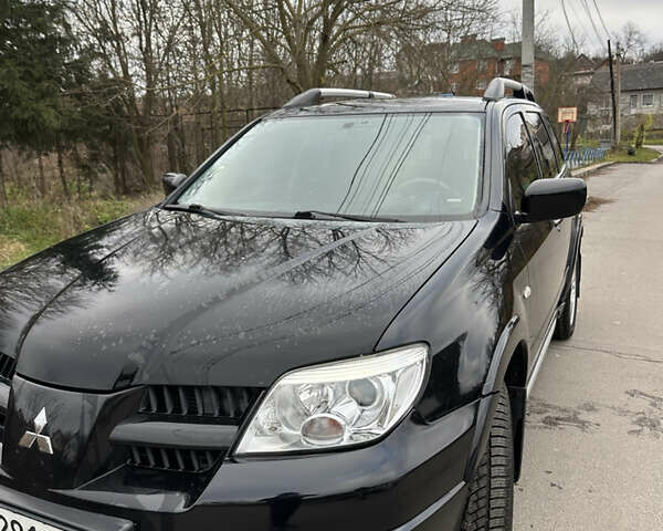 Чорний Міцубісі Аутлендер, об'ємом двигуна 2 л та пробігом 118 тис. км за 8100 $, фото 3 на Automoto.ua