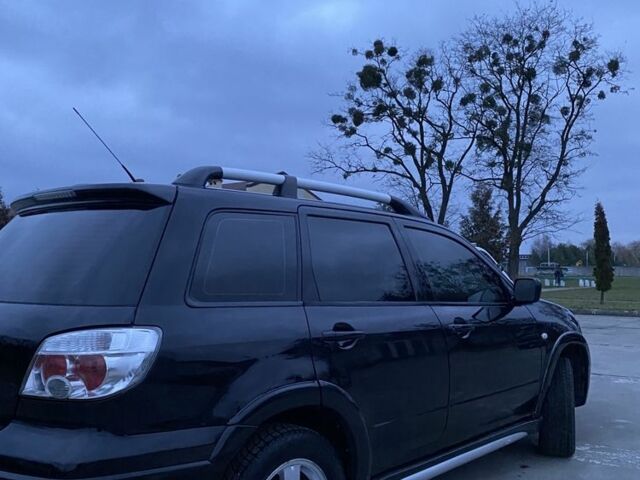 Чорний Міцубісі Аутлендер, об'ємом двигуна 2 л та пробігом 271 тис. км за 6799 $, фото 3 на Automoto.ua