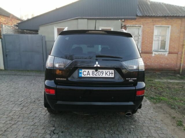 Черный Мицубиси Аутлендер, объемом двигателя 2.4 л и пробегом 228 тыс. км за 7850 $, фото 5 на Automoto.ua