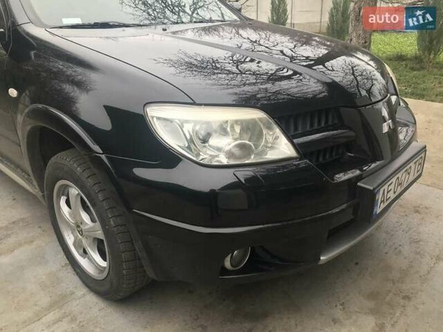 Чорний Міцубісі Аутлендер, об'ємом двигуна 2.38 л та пробігом 207 тис. км за 7000 $, фото 13 на Automoto.ua