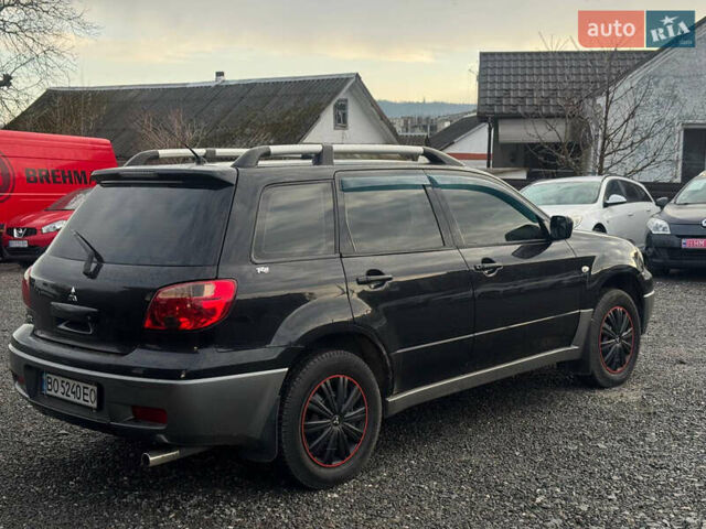Черный Мицубиси Аутлендер, объемом двигателя 2 л и пробегом 240 тыс. км за 5500 $, фото 6 на Automoto.ua