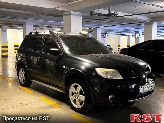 Черный Мицубиси Аутлендер, объемом двигателя 2.4 л и пробегом 260 тыс. км за 8100 $, фото 2 на Automoto.ua