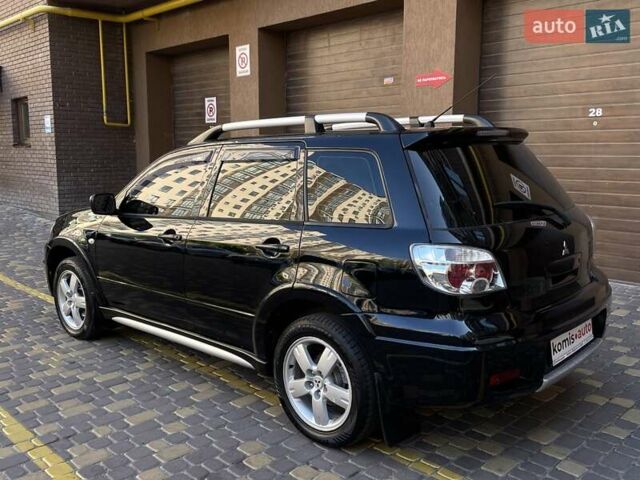 Черный Мицубиси Аутлендер, объемом двигателя 2 л и пробегом 270 тыс. км за 7199 $, фото 14 на Automoto.ua