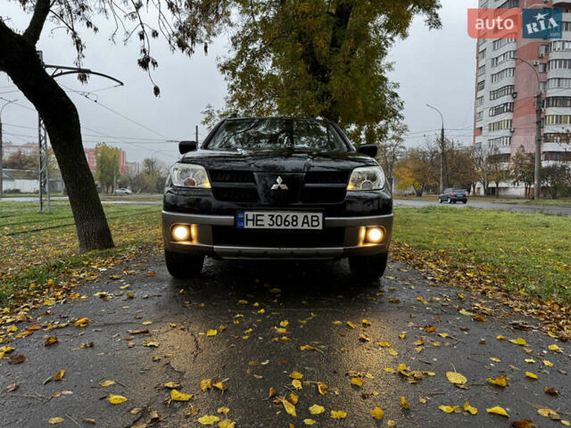 Чорний Міцубісі Аутлендер, об'ємом двигуна 2 л та пробігом 254 тис. км за 7499 $, фото 1 на Automoto.ua