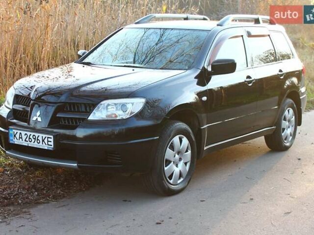 Черный Мицубиси Аутлендер, объемом двигателя 2 л и пробегом 190 тыс. км за 6900 $, фото 21 на Automoto.ua