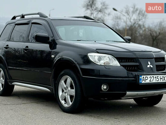 Черный Мицубиси Аутлендер, объемом двигателя 2.4 л и пробегом 245 тыс. км за 6500 $, фото 4 на Automoto.ua