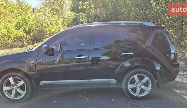 Черный Мицубиси Аутлендер, объемом двигателя 2.4 л и пробегом 178 тыс. км за 9150 $, фото 4 на Automoto.ua