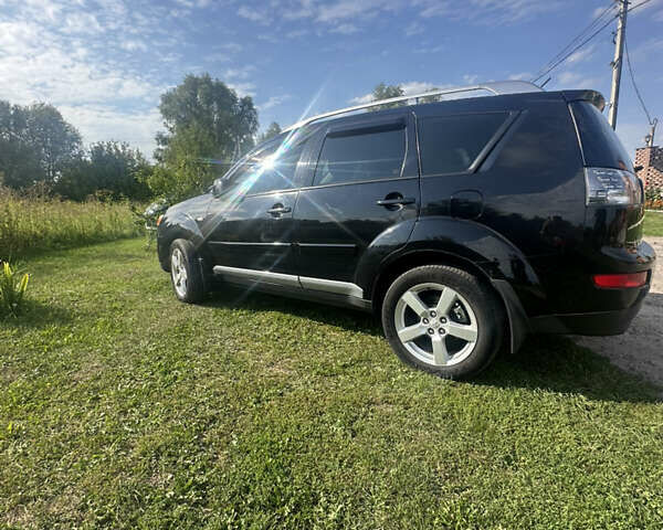 Черный Мицубиси Аутлендер, объемом двигателя 2.36 л и пробегом 240 тыс. км за 9599 $, фото 6 на Automoto.ua