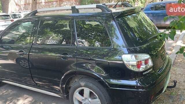 Черный Мицубиси Аутлендер, объемом двигателя 2.4 л и пробегом 150 тыс. км за 6300 $, фото 3 на Automoto.ua