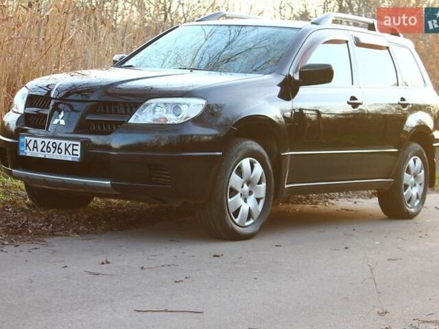 Черный Мицубиси Аутлендер, объемом двигателя 2 л и пробегом 190 тыс. км за 6900 $, фото 15 на Automoto.ua