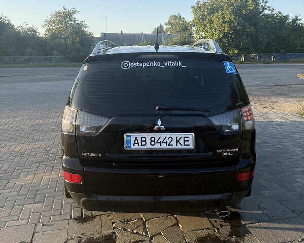 Чорний Міцубісі Аутлендер, об'ємом двигуна 2.4 л та пробігом 248 тис. км за 9500 $, фото 2 на Automoto.ua