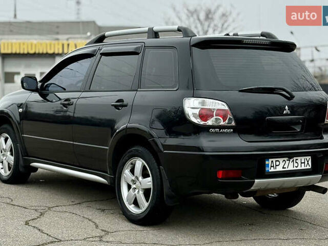 Черный Мицубиси Аутлендер, объемом двигателя 2.4 л и пробегом 245 тыс. км за 6500 $, фото 7 на Automoto.ua