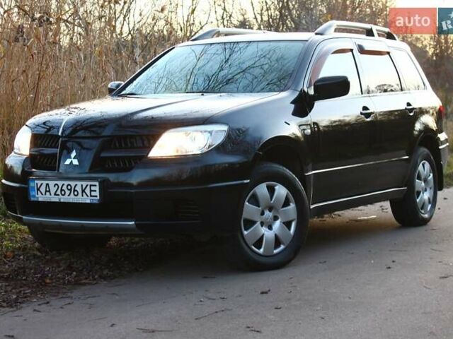 Черный Мицубиси Аутлендер, объемом двигателя 2 л и пробегом 189 тыс. км за 7200 $, фото 31 на Automoto.ua