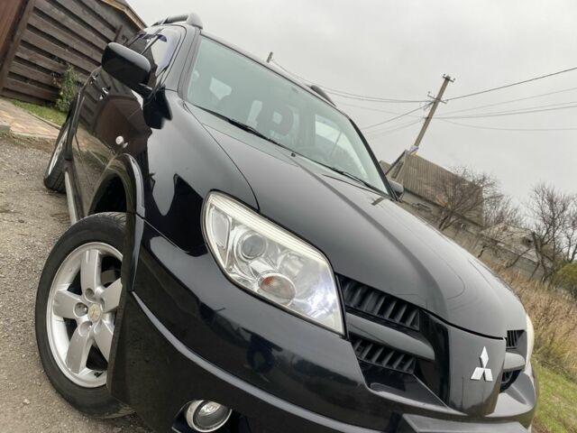 Черный Мицубиси Аутлендер, объемом двигателя 2.4 л и пробегом 178 тыс. км за 6900 $, фото 6 на Automoto.ua