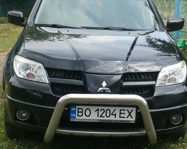 Чорний Міцубісі Аутлендер, об'ємом двигуна 2 л та пробігом 208 тис. км за 6700 $, фото 11 на Automoto.ua