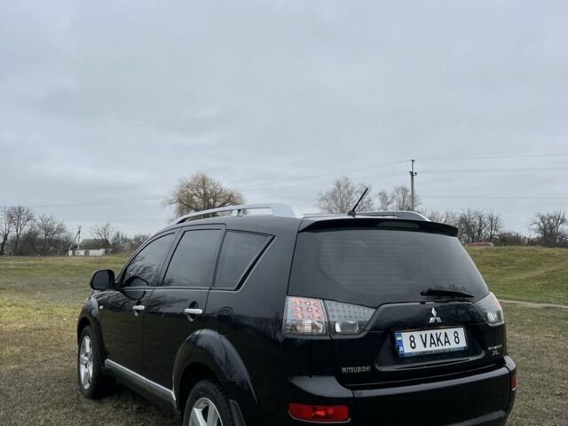 Черный Мицубиси Аутлендер, объемом двигателя 2.4 л и пробегом 230 тыс. км за 8800 $, фото 3 на Automoto.ua