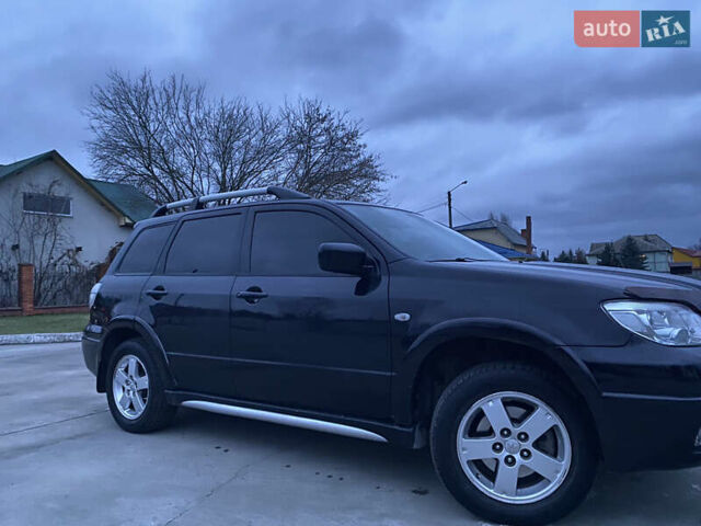 Чорний Міцубісі Аутлендер, об'ємом двигуна 2 л та пробігом 271 тис. км за 6799 $, фото 3 на Automoto.ua