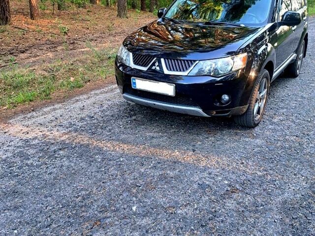 Черный Мицубиси Аутлендер, объемом двигателя 2.4 л и пробегом 241 тыс. км за 9300 $, фото 3 на Automoto.ua