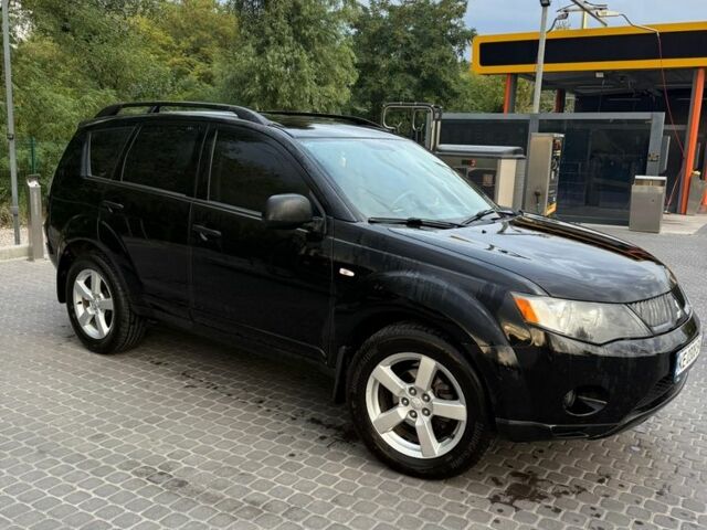 Черный Мицубиси Аутлендер, объемом двигателя 2.4 л и пробегом 369 тыс. км за 8500 $, фото 1 на Automoto.ua