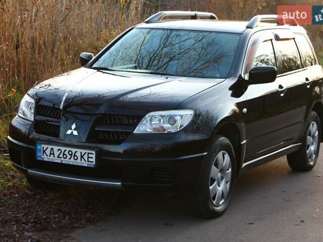 Черный Мицубиси Аутлендер, объемом двигателя 2 л и пробегом 189 тыс. км за 7200 $, фото 36 на Automoto.ua