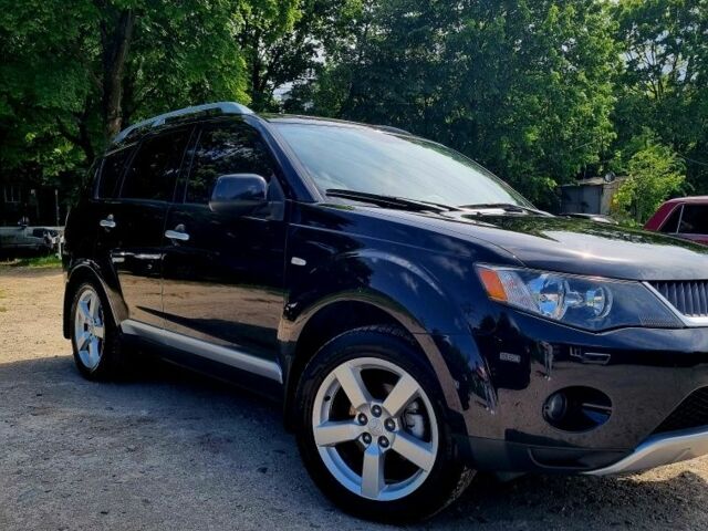 Черный Мицубиси Аутлендер, объемом двигателя 2.4 л и пробегом 234 тыс. км за 9800 $, фото 1 на Automoto.ua