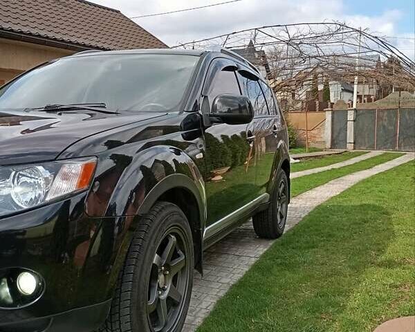 Черный Мицубиси Аутлендер, объемом двигателя 2.35 л и пробегом 245 тыс. км за 8000 $, фото 22 на Automoto.ua