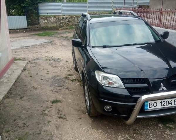 Чорний Міцубісі Аутлендер, об'ємом двигуна 2 л та пробігом 208 тис. км за 6700 $, фото 10 на Automoto.ua