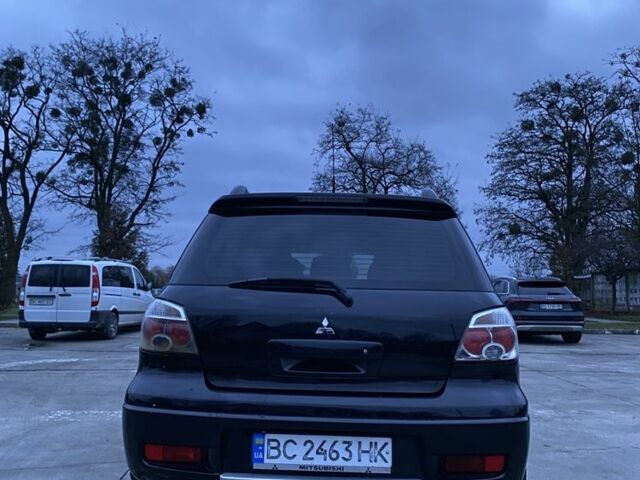 Чорний Міцубісі Аутлендер, об'ємом двигуна 2 л та пробігом 271 тис. км за 6799 $, фото 4 на Automoto.ua