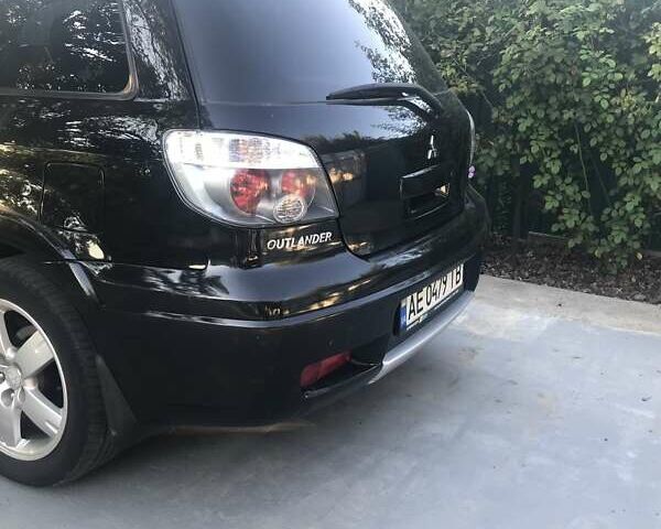 Чорний Міцубісі Аутлендер, об'ємом двигуна 2.38 л та пробігом 207 тис. км за 7000 $, фото 60 на Automoto.ua